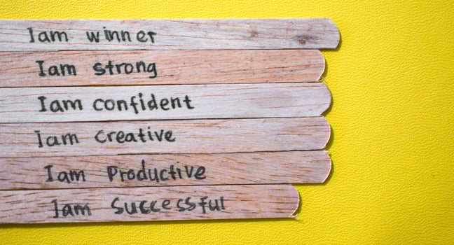 stick of ice cream with the words I am winner, strong, confident, creative, productive, successful. Motivational quotes, optimism, positive words photo