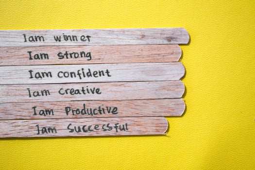 stick of ice cream with the words I am winner, strong, confident, creative, productive, successful. Motivational quotes, optimism, positive words photo