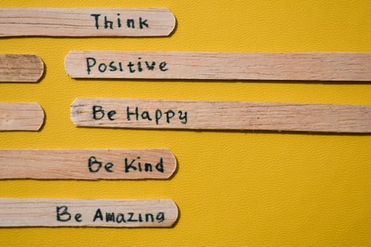 stick of ice cream with the words Think Positive, Be happy, Be Kind, Be Amazing. Motivational quotes, optimism, positive words. Isolated on background photo