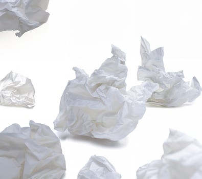 Close-up of a crumpled white tissue paper isolated on a white background, minimalistic and clean concept photo