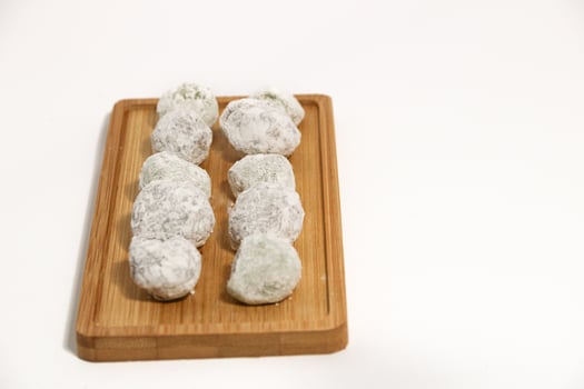 Mochi - trendy and sweet dessert, Mochi cake on a plate on a white background. photo