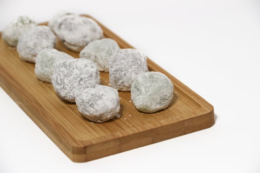 Mochi - trendy and sweet dessert, Mochi cake on a plate on a white background. photo