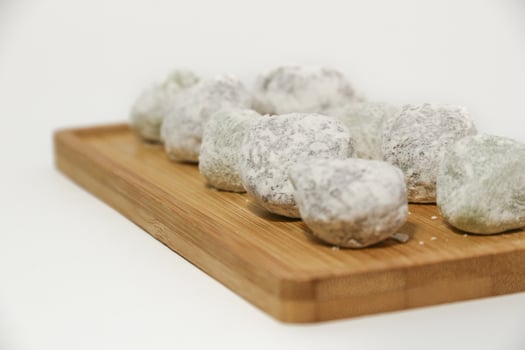 Mochi - trendy and sweet dessert, Mochi cake on a plate on a white background. photo