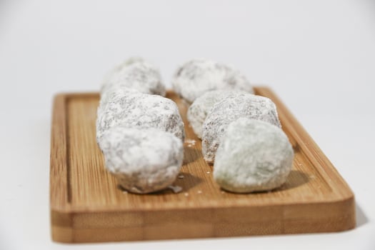 Mochi - trendy and sweet dessert, Mochi cake on a plate on a white background. photo