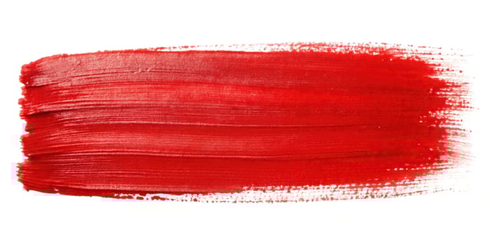 Red watercolor brush strokes on white background photo