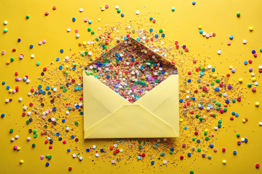 Party invitation with confetti on yellow background photo