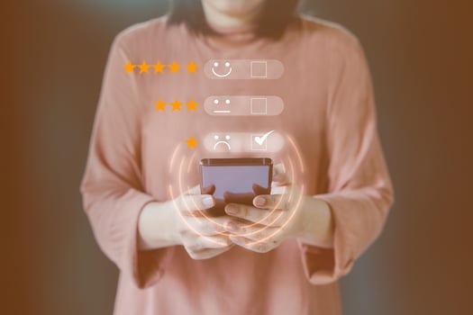 Customer satisfaction assessment and concept. Business man use mobile phone to provide online ratings and opinions, experience survey to evaluate the services from the application and give unsatisfied photo