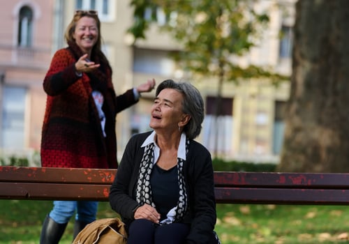 Embracing Generations. A Daughter's Love and Support for Her Senior Mother on a Sunny Day in the Park photo