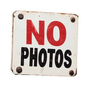 A no photos sign on a white background