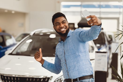 New Car. Happy Auto Buyer Man Making Selfie Near His Automobile Gesturing Thumbs-Up In Dealership Center. photo