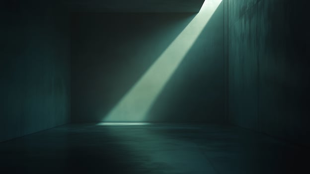 A narrow beam of light illuminates a dimly lit, empty concrete room with smooth walls, creating an atmosphere of solitude and mystery photo