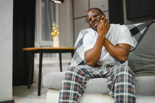 Portrait of African Man having Toothache, Tooth infection photo