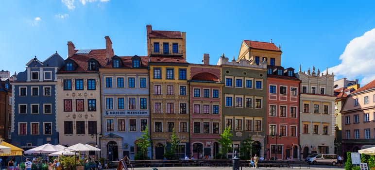The historic tenement houses around Warsaws Market Square showcase beautiful 17th-century architecture with vibrant colors and details, restored after World War II, reflecting the citys rich heritage. photo