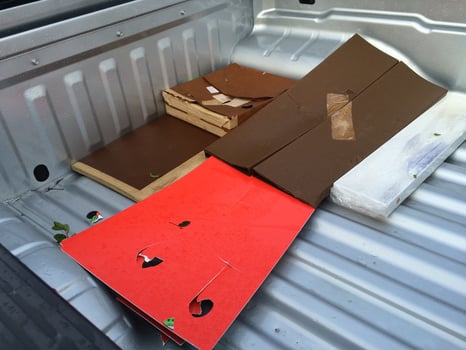 Hail Damage to Various Construction Materials in the Bed of Pick Up Truck photo