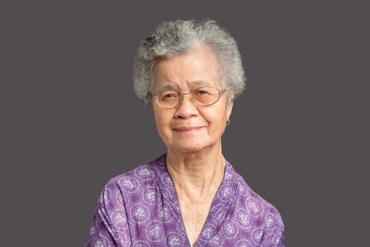 Senior woman with short gray hair looking at the camera with a smile photo