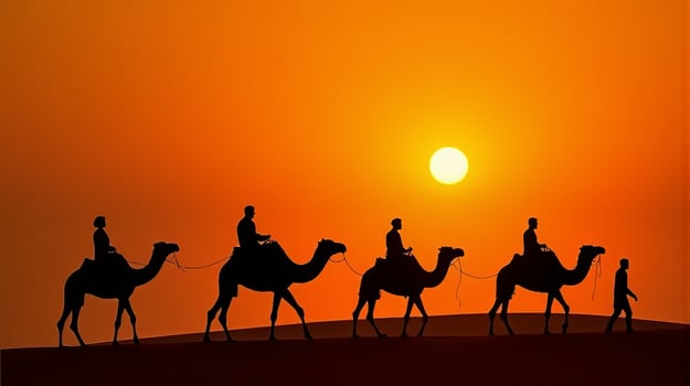 Silhouette of Camel Riders Against an Orange Hued Sky on a Desert Dunes Under Dramatic Sunset photo