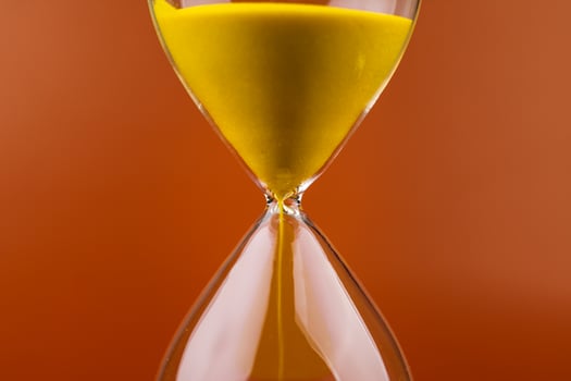 Hourglass with running out of time Concept of time and life Work with time as a deadline photo