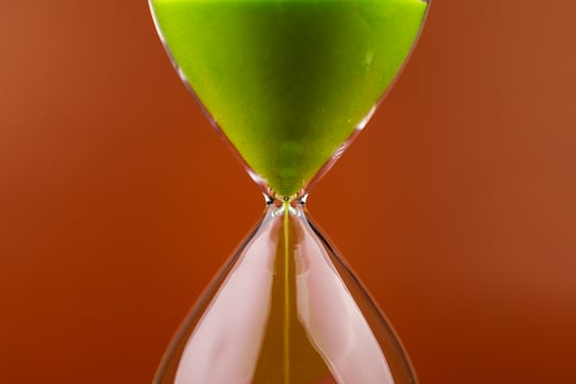 Hourglass with running out of time Concept of time and life Work with time as a deadline photo