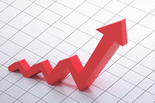 Red arrow against white grid rises, indicating upward data trends photo