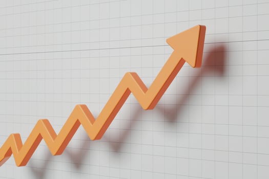 3D orange arrow on line graph, against white grid, indicates growth photo