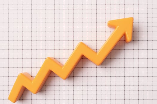 Orange line chart shows upward trend on a white grid photo