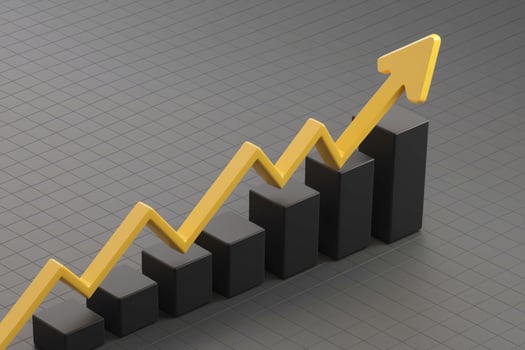 Yellow line chart shows growth on a grid photo