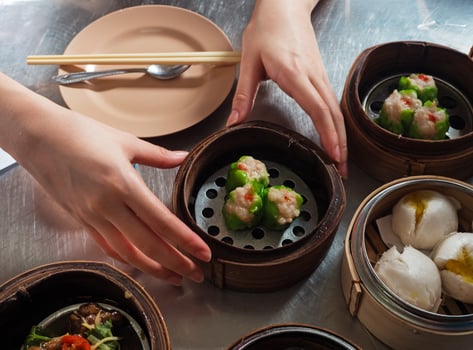 Hand touch basket of chinese food. photo
