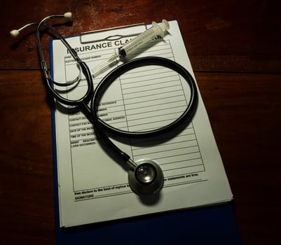 Stethoscope and insurance form photo