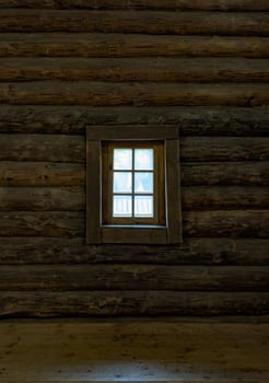 A close-up of beautifully carved wooden windows on a traditional Russian log house , izba. The ornate shutters, detailed woodwork, and charming flower bed create a picturesque, rustic ambiance photo