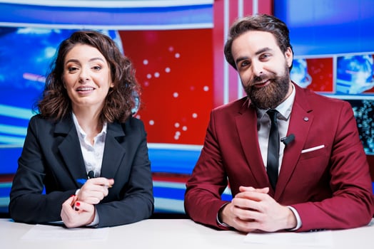 Broadcasters team present daily news live on television network, discussing about latest events on morning show. Media journalists reading important headlines of the day, create content. photo