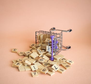 Shopping cart and numberic wood block put on background. photo