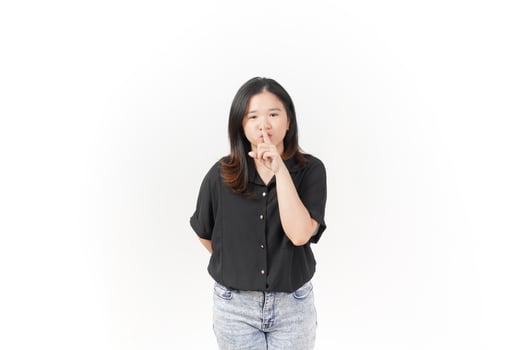 Beautiful Asian Woman finger on lips, shh silent sign Isolated On White Background photo