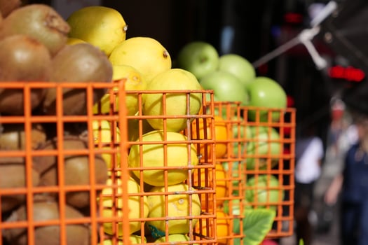 Colorful and Vibrant Fruit Stalls Featuring Fresh Produce A Lively Marketplace Scene photo