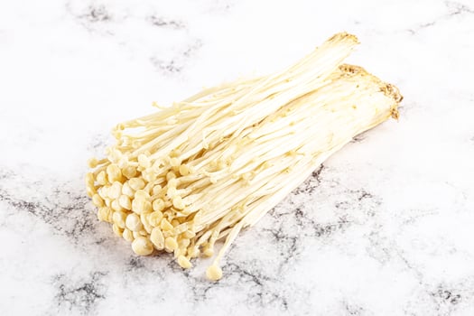 Tasty raw enoki mushroom heap photo