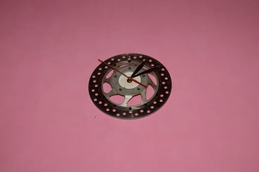 handmade wall clock from used motorcycle discs photo