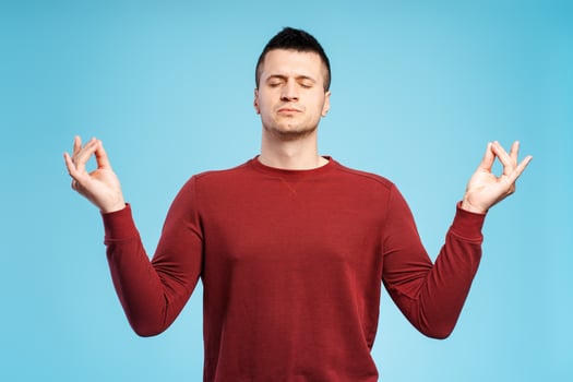 Portrait of middle aged, focused, calm, man meditating, with closed eyes zen gesture photo