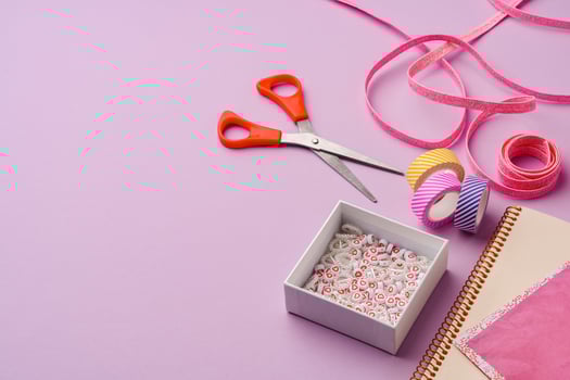 Crafting supplies on a purple background ready for creative projects photo