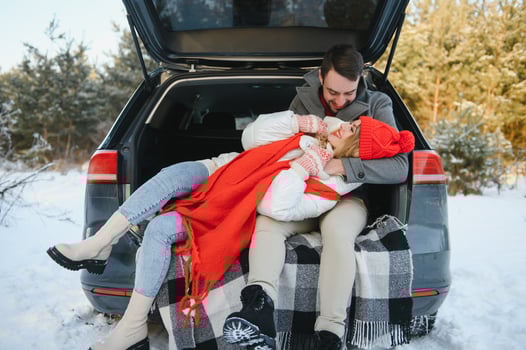 Photo of young attractive couple happy positive smile look each other enjoy time together forest winter love story