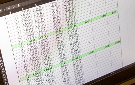 Shot of an dark mode excel sheet on computer screen showing bank loan amortization table. Banking photo
