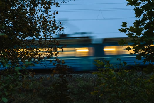 The electric train goes fast in the evening. Long exposure, lubrication photo