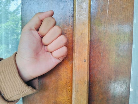 Hand about to knock on wood photo