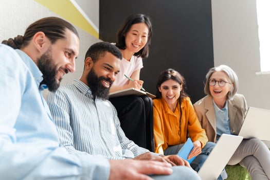 Diverse multiethnic team of professionals collaborating on project in modern office photo