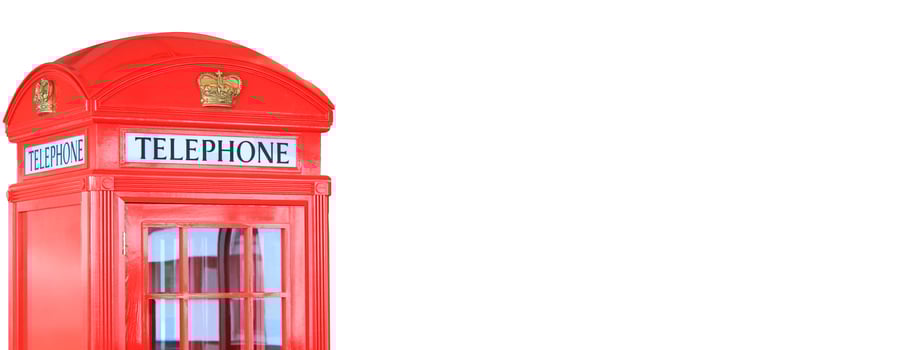 Red traditional telephone booth isolated on white background photo