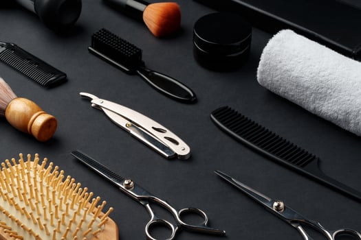 Variety of Hair Styling Tools and Accessories Displayed on a Dark Background photo