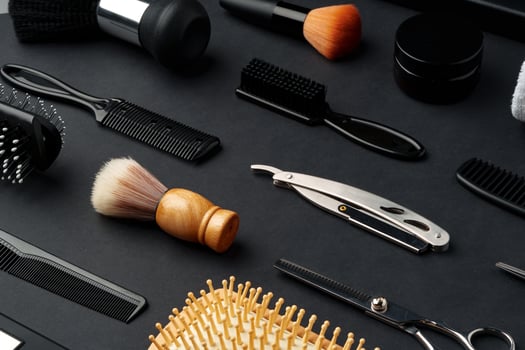 Variety of Hair Styling Tools and Accessories Displayed on a Dark Background photo