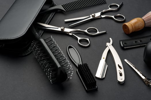 Variety of Hair Styling Tools and Accessories Displayed on a Dark Background photo