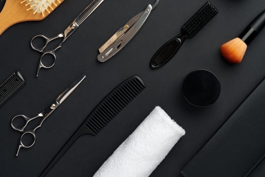 Variety of Hair Styling Tools and Accessories Displayed on a Dark Background photo