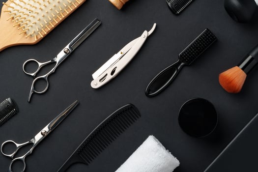 Variety of Hair Styling Tools and Accessories Displayed on a Dark Background photo