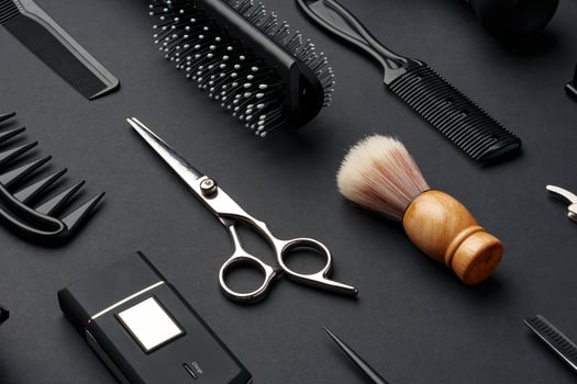 Variety of Hair Styling Tools and Accessories Displayed on a Dark Background photo