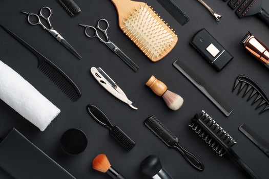 Variety of Hair Styling Tools and Accessories Displayed on a Dark Background photo
